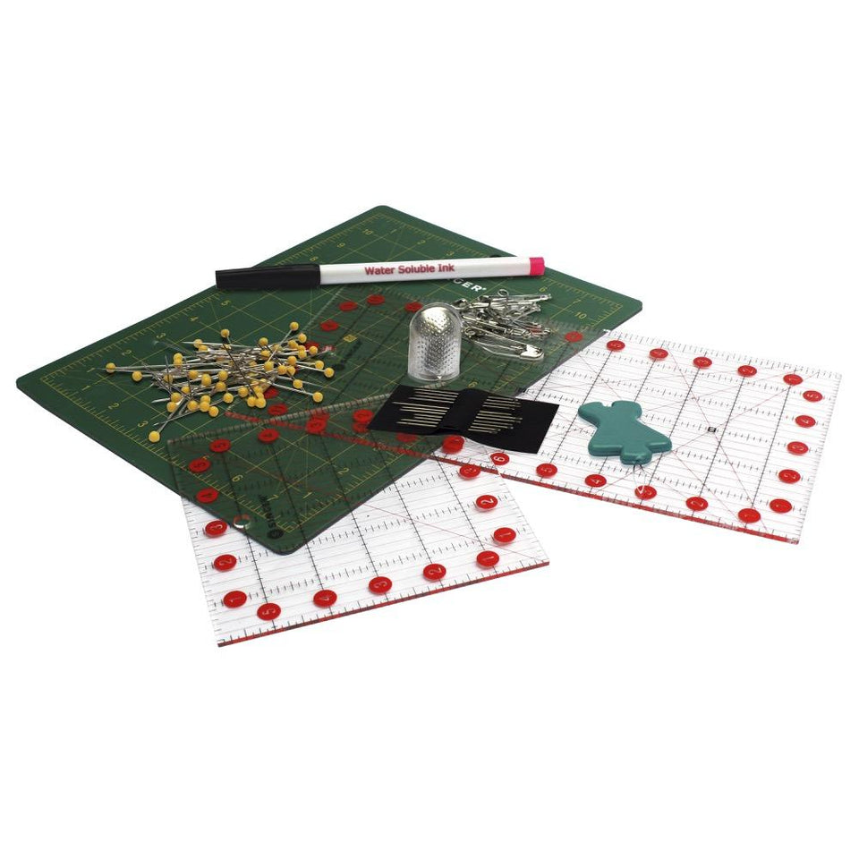 Kit de manualidades quilting y patchwork Singer, incluye: Tabla para corte de tela, Reglas de corte con medidas en pulgadas, seguros, Agujas, Dedal, Marcador para telas, ensartador de aguja manual